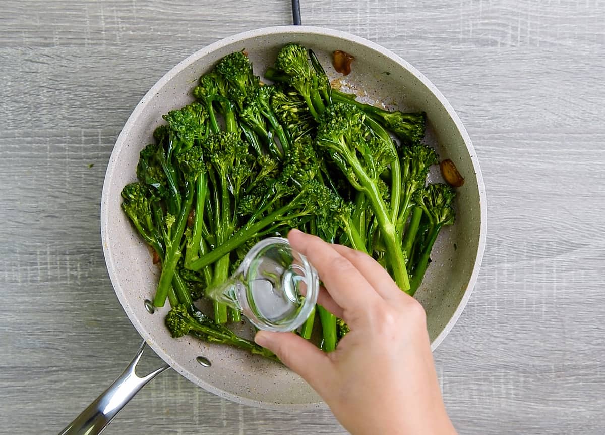 adding water to steam broccolini