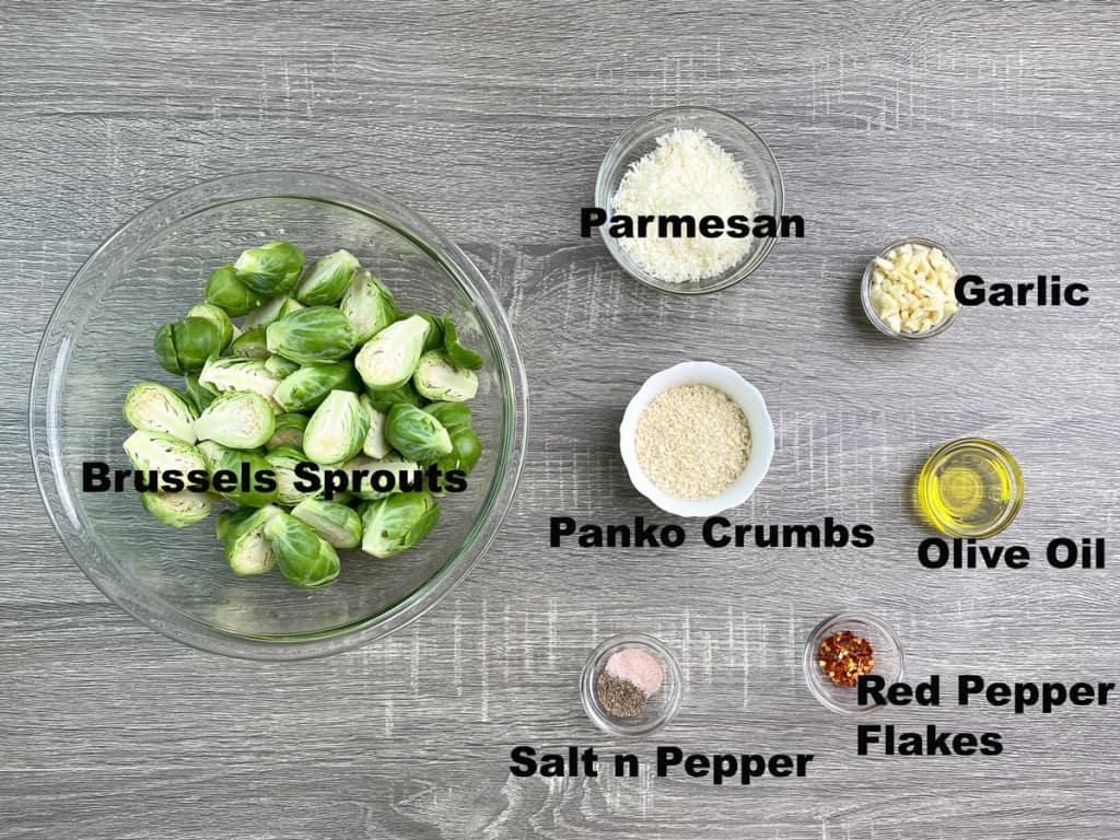 ingredients for making spicy garlic roasted brussel sprouts measured out into bowls