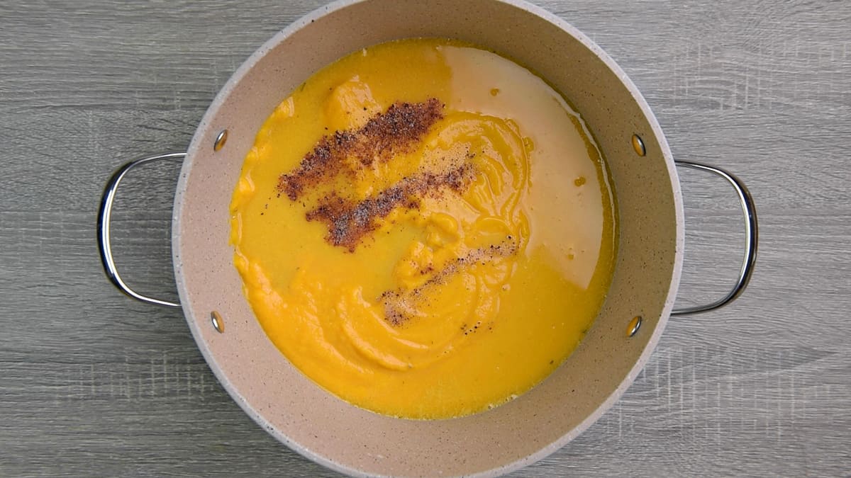 one pot of butternut squash soup with spices 