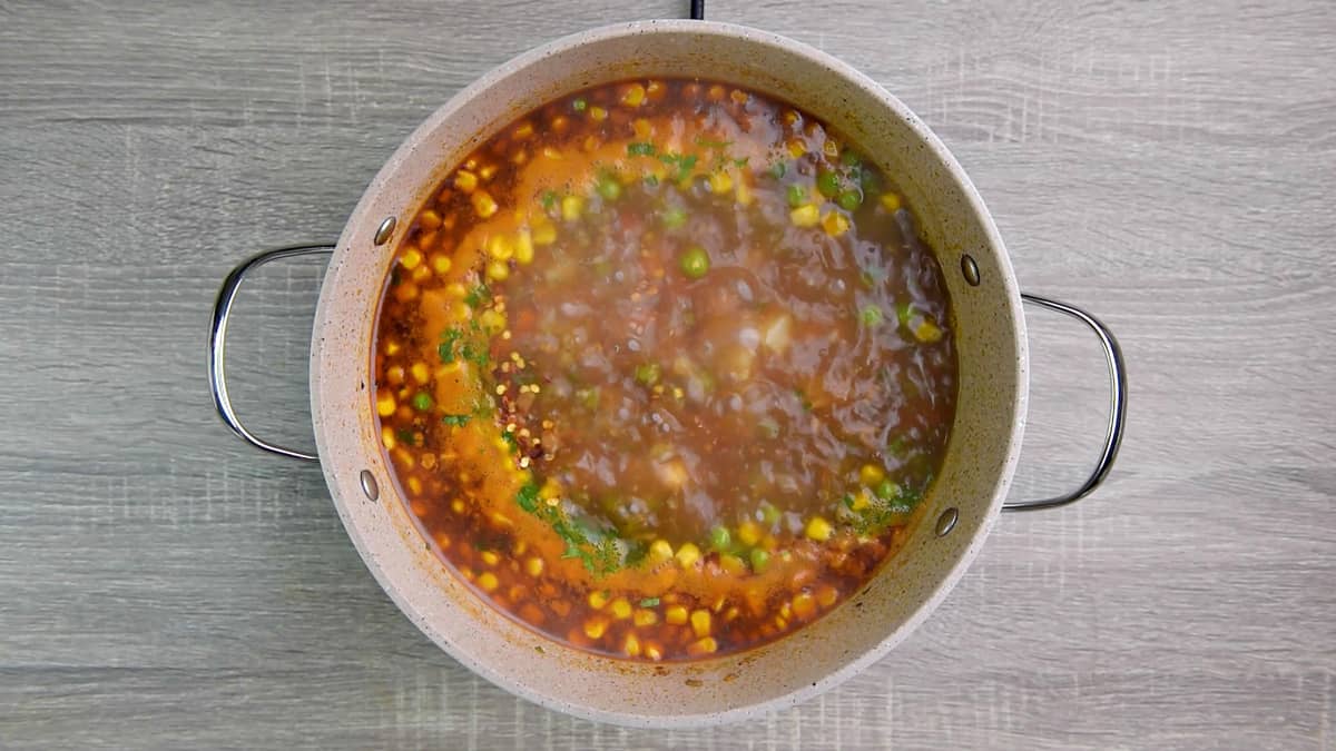 boiling vegetables in broth for veggie soup recipe 