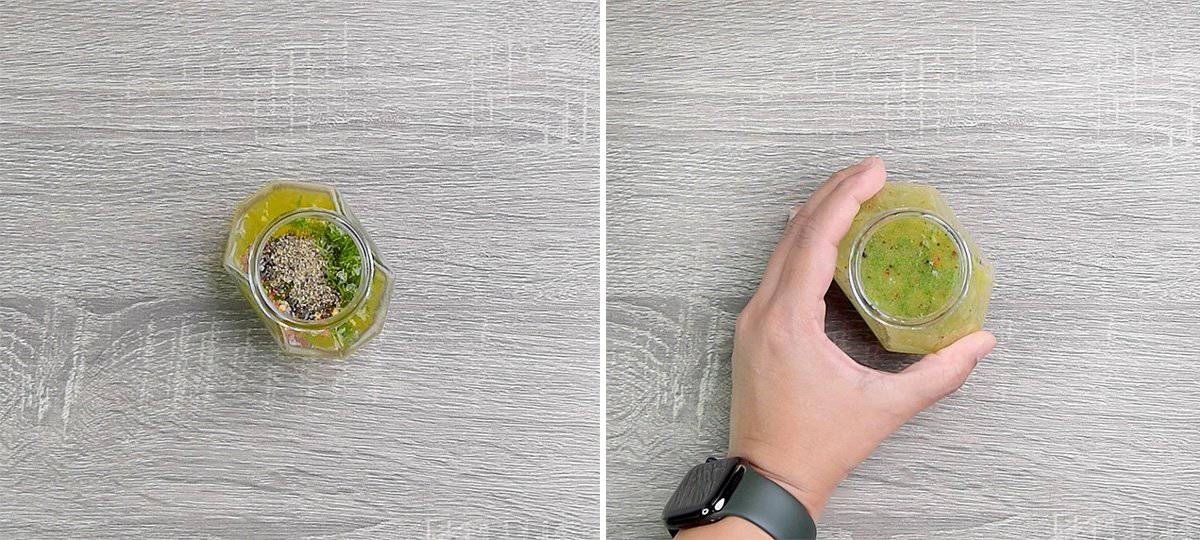 preparing salad dressing in jar with hand 