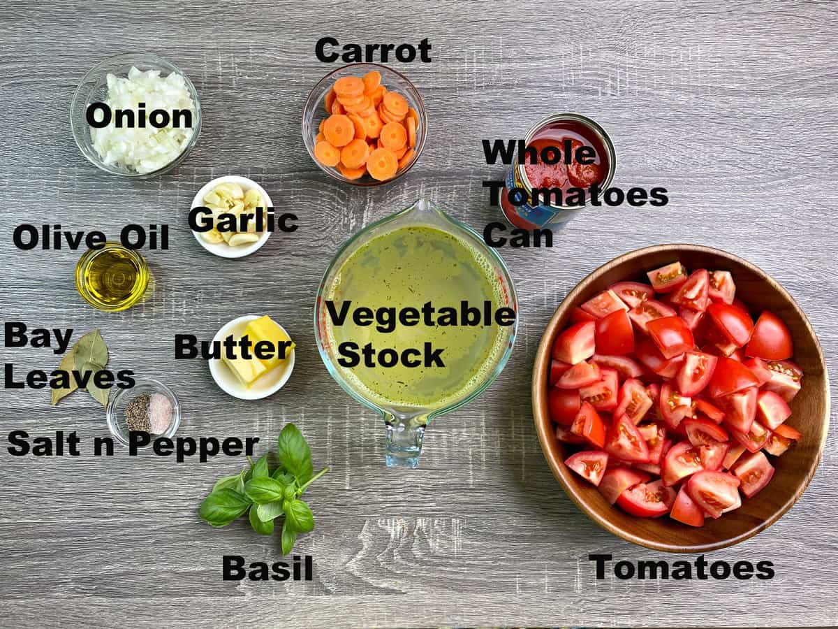 onion, garlic, oil, bay leaves, salt, pepper, basil, veggie broth, carrot, tomatoes, butter measured in bowls