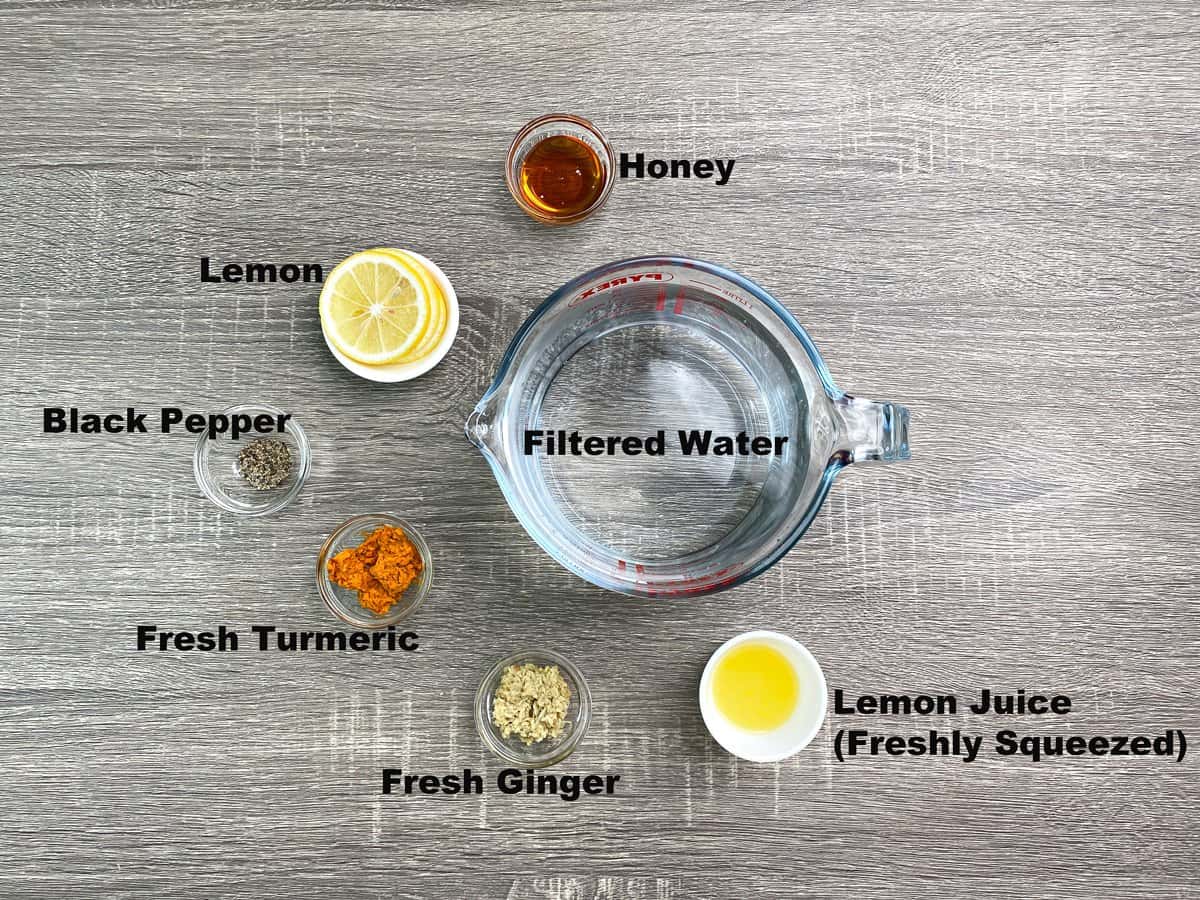 ingredients for turmeric and ginger tea measured in glass bowls.