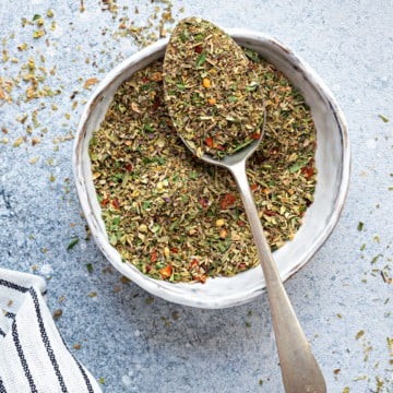 overhead shot of Italian Seasoning mix in white ceramic bowl.