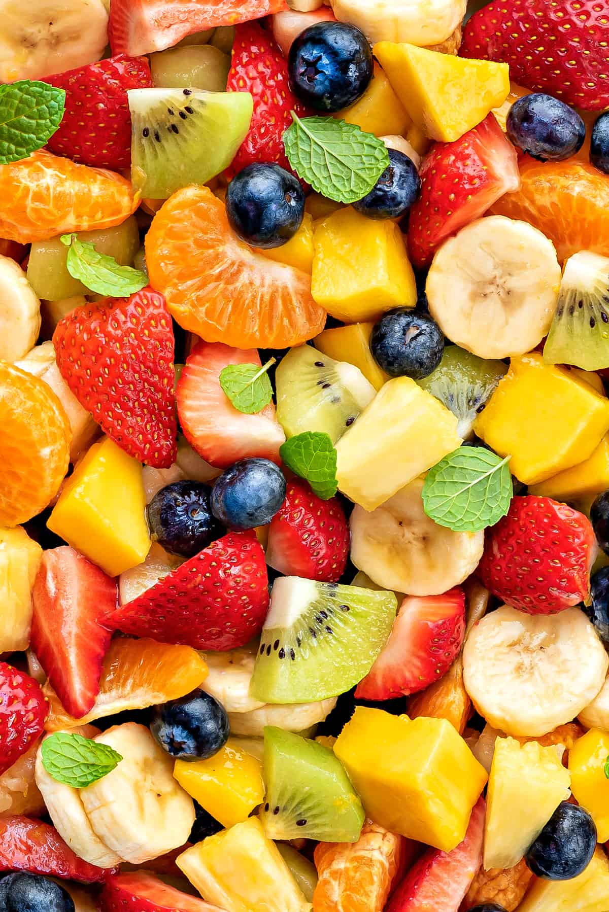 close-up of fresh summer fruit salad with fresh mint.