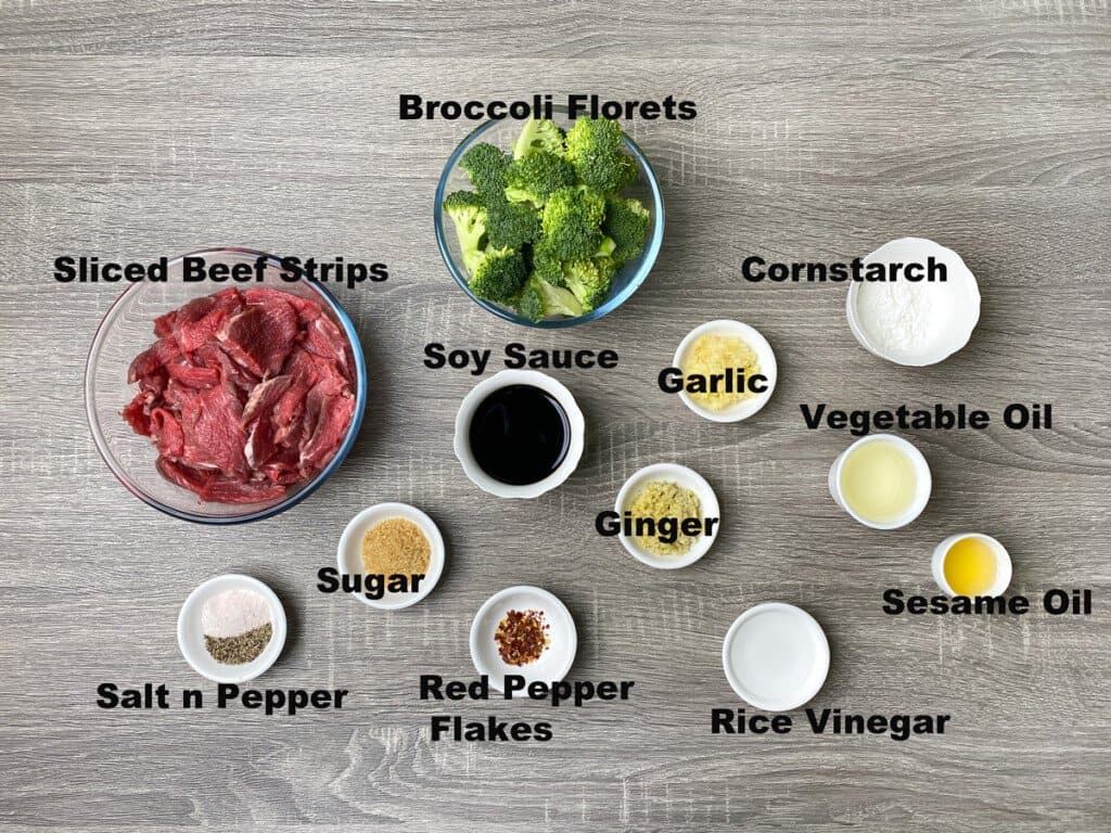 Each ingredient correctly measured into glass bowls for beef broccoli. 