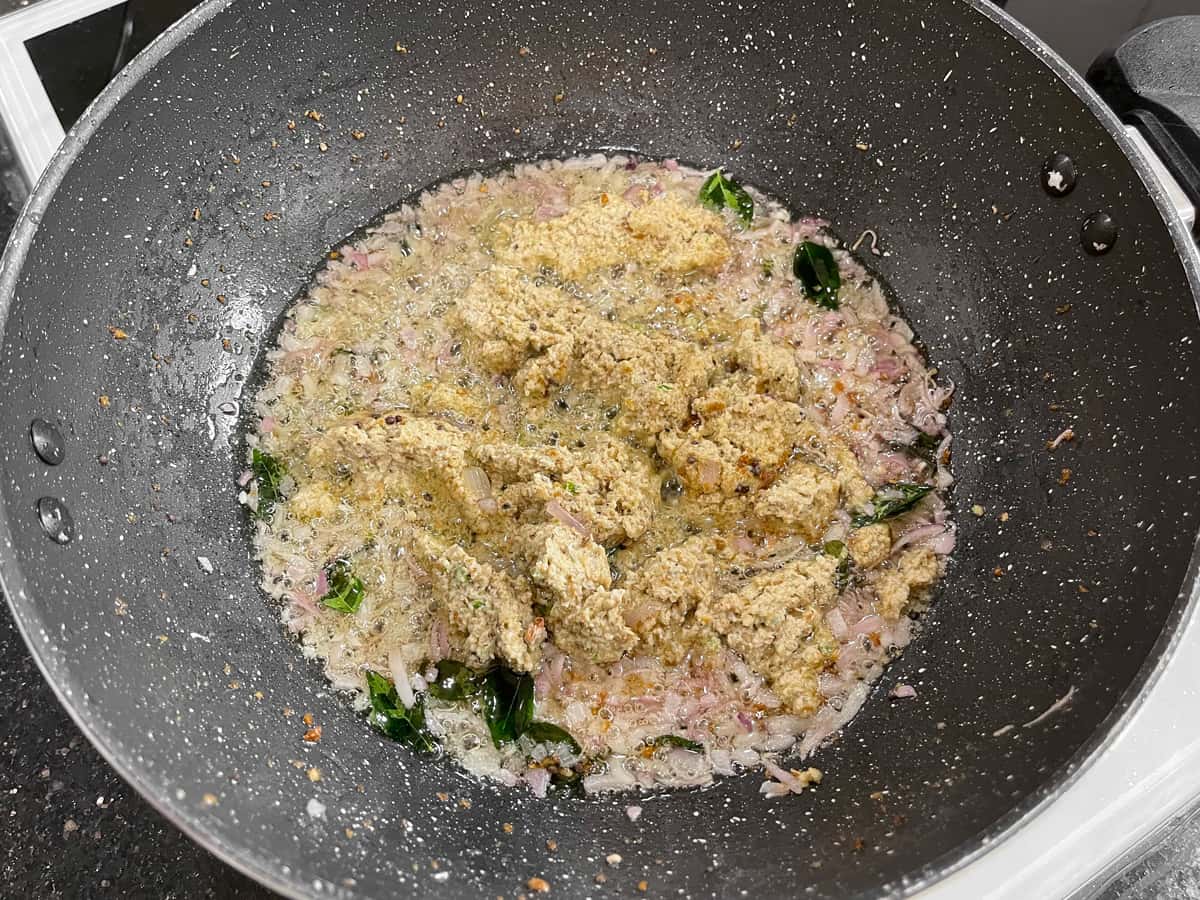 The remaining ground masala paste added in the pan to sauté for making a gravy base.