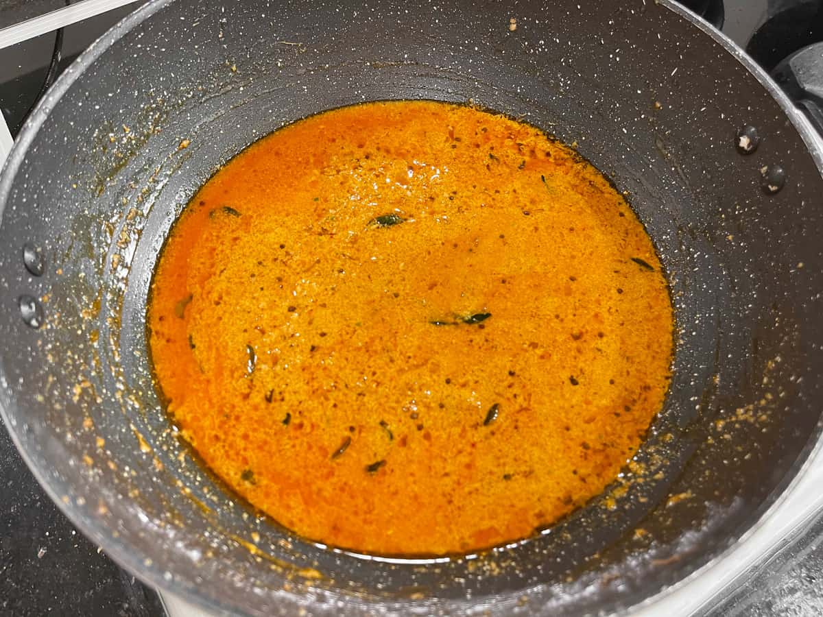 Water added in the pan to make the gravy for bagara baingan.