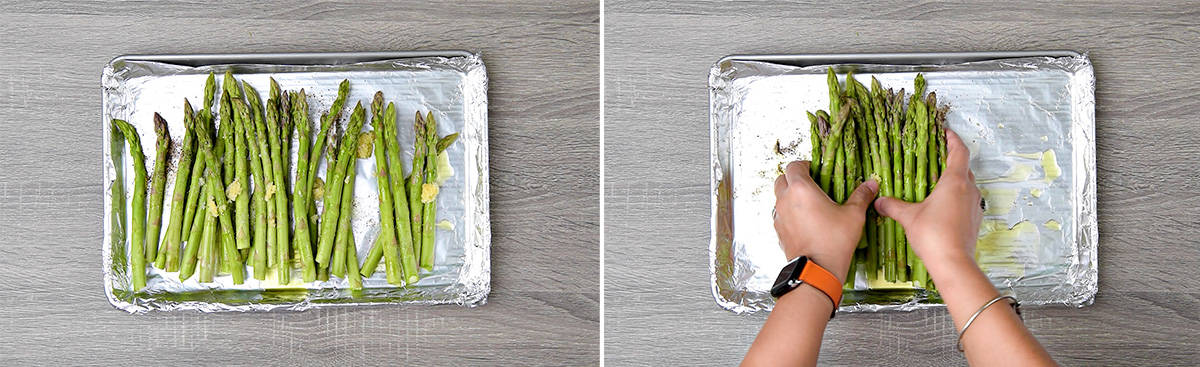 Person adding raw asparagus to a baking sheet lined with foil. Tossing asparagus with olive oil, garlic, salt and pepper. 