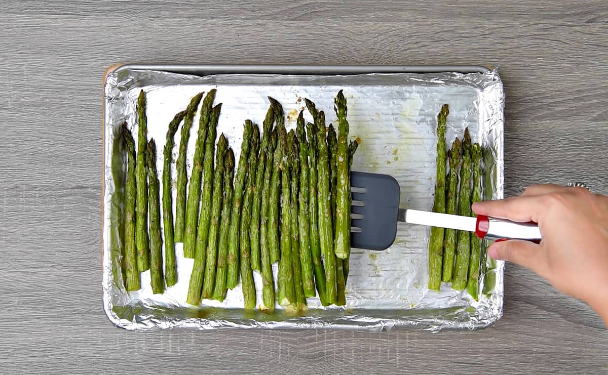 Oven roasted asparagus on a foil linked baking sheet. 