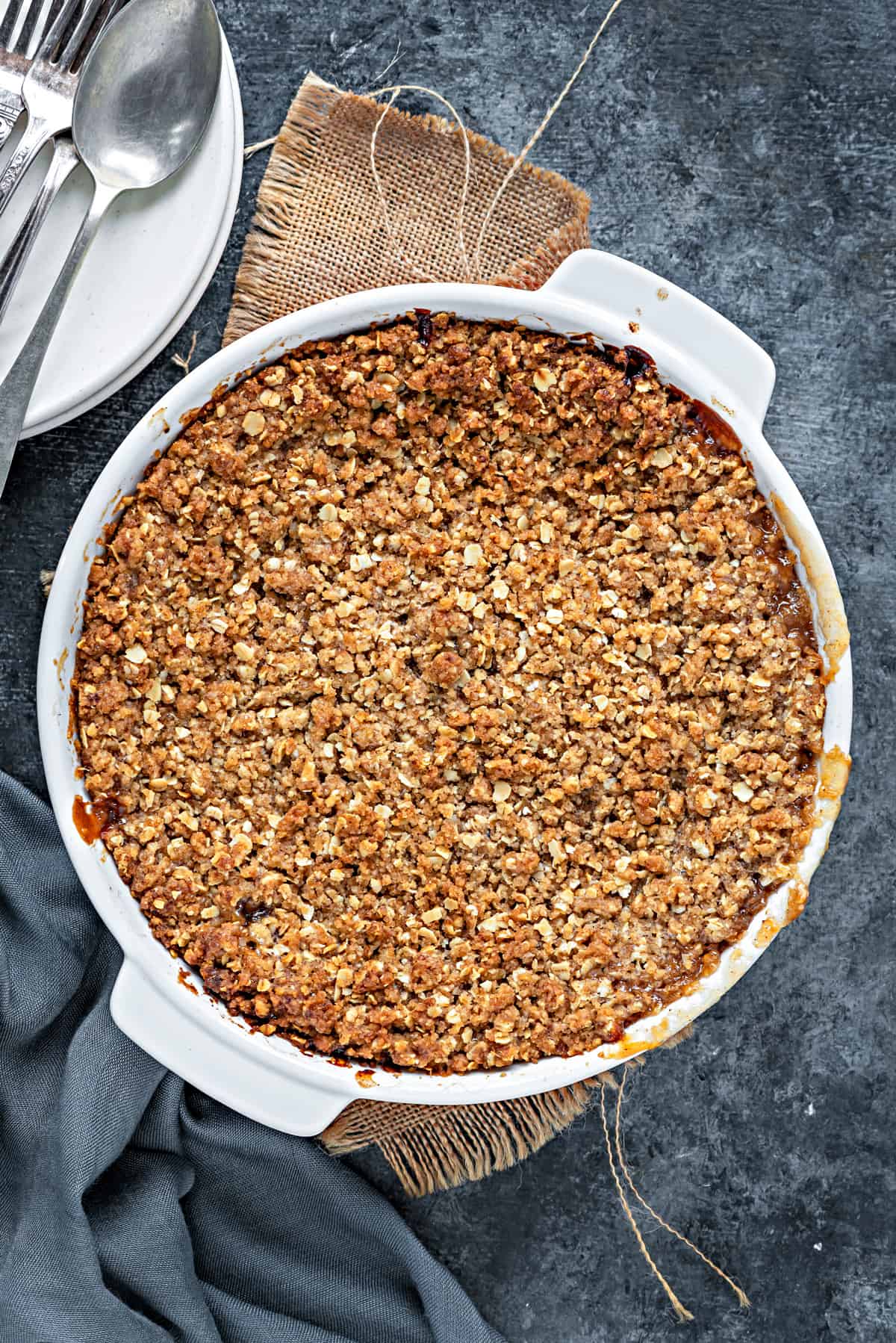 Baked apple crumble with oat topping hot out of the oven.