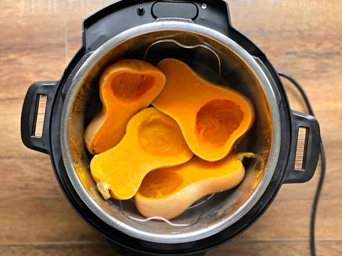 Cooked butternut squash halves in the instant pot.