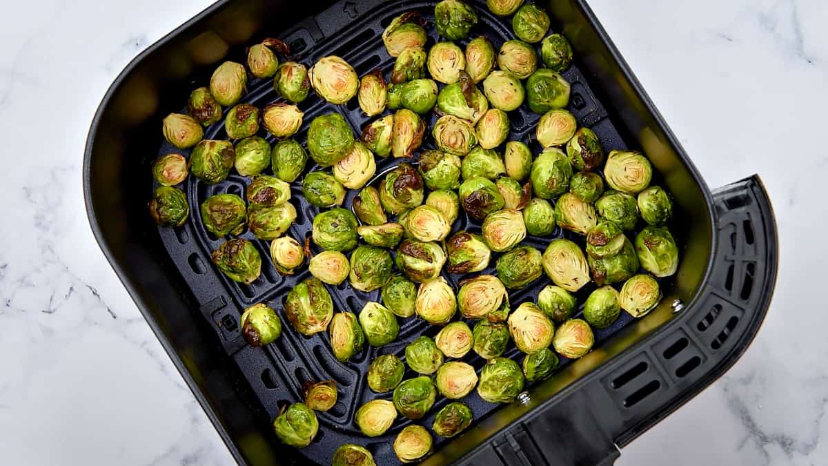 Crispy air fried sprouts in the basket.
