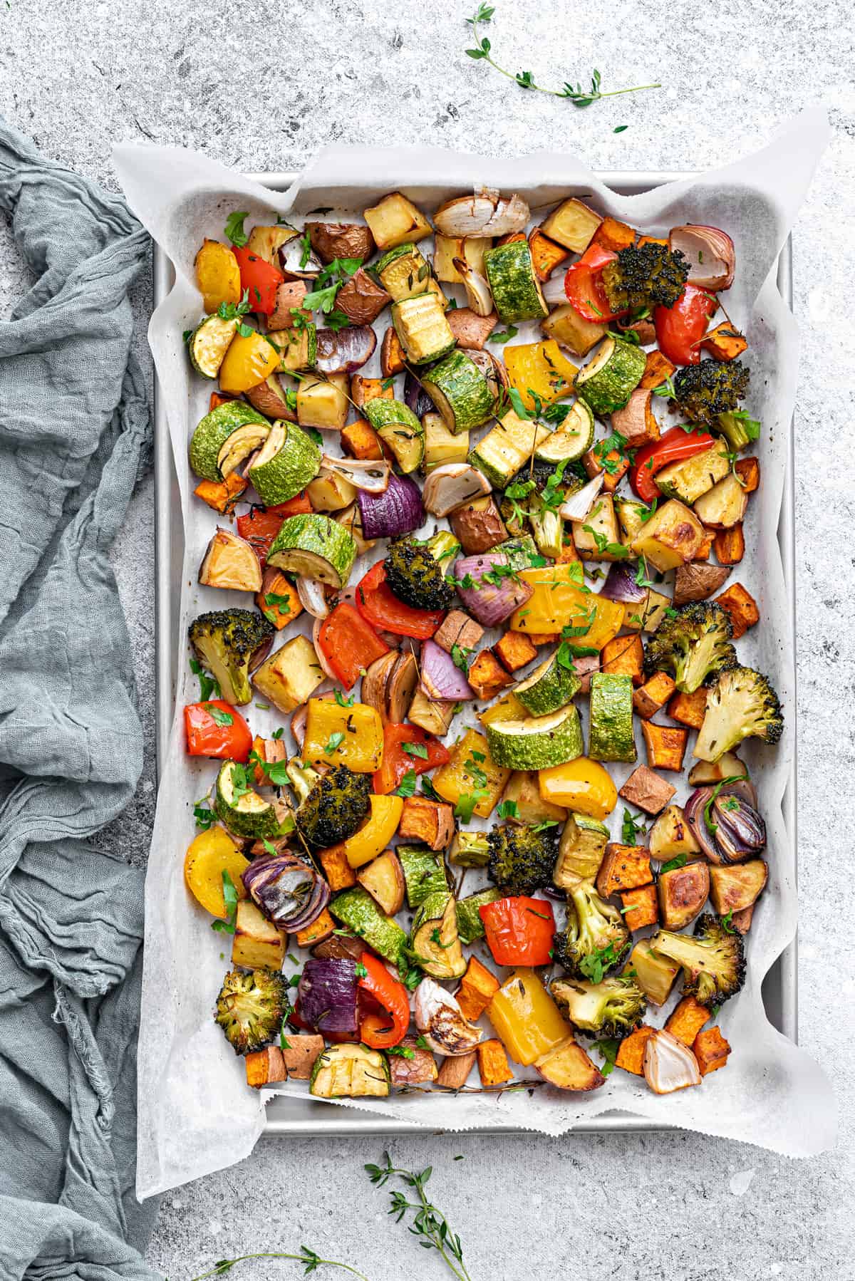 Top down shot - roasted veggies on a baking sheet pan.