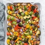 Top down shot of roasted vegetables on a baking sheet pan.