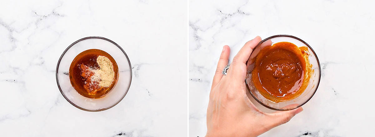 Hand with small glass mixing container of marinade.