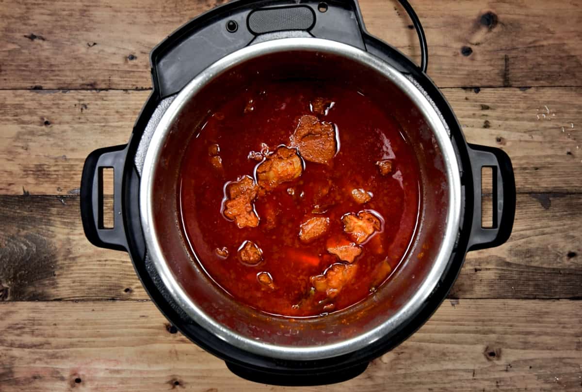 Cooked lamb vindaloo in pot is ready to serve.