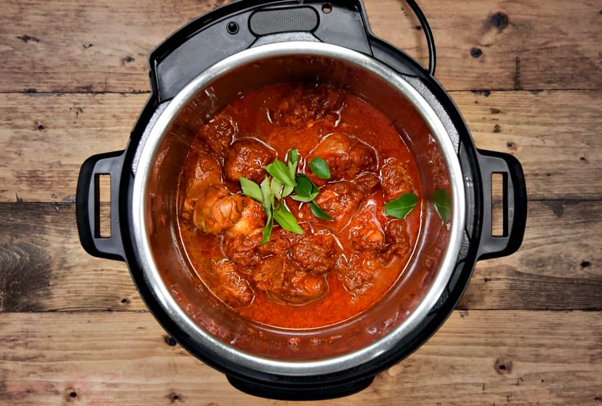 Water and curry leaves added to the pot