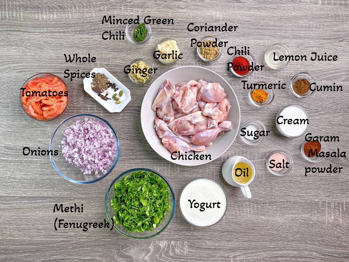 Methi chicken recipe ingredients each in individual glass bowls.