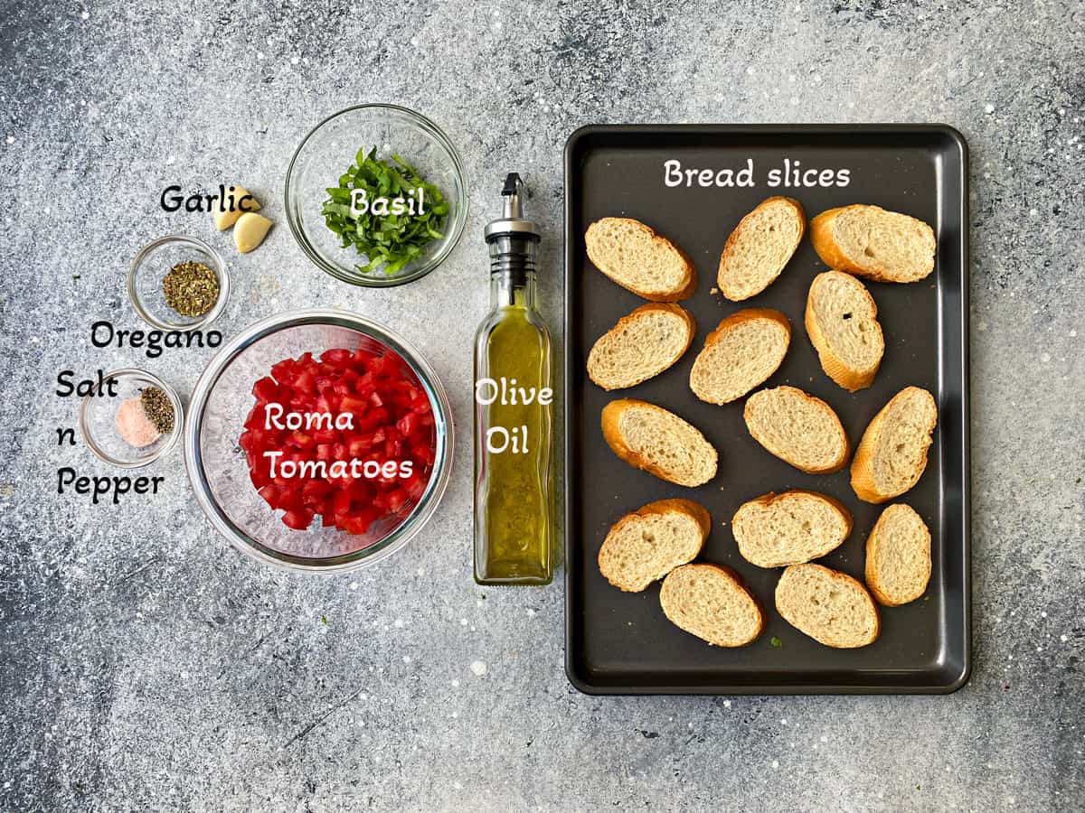 Recipe ingredients: Baking pan with 14 slices of baguette, bottle of olive oil, and individual glass bowls of diced roma tomatoes, sliced basil, garlic, oregano,salt, and pepper.