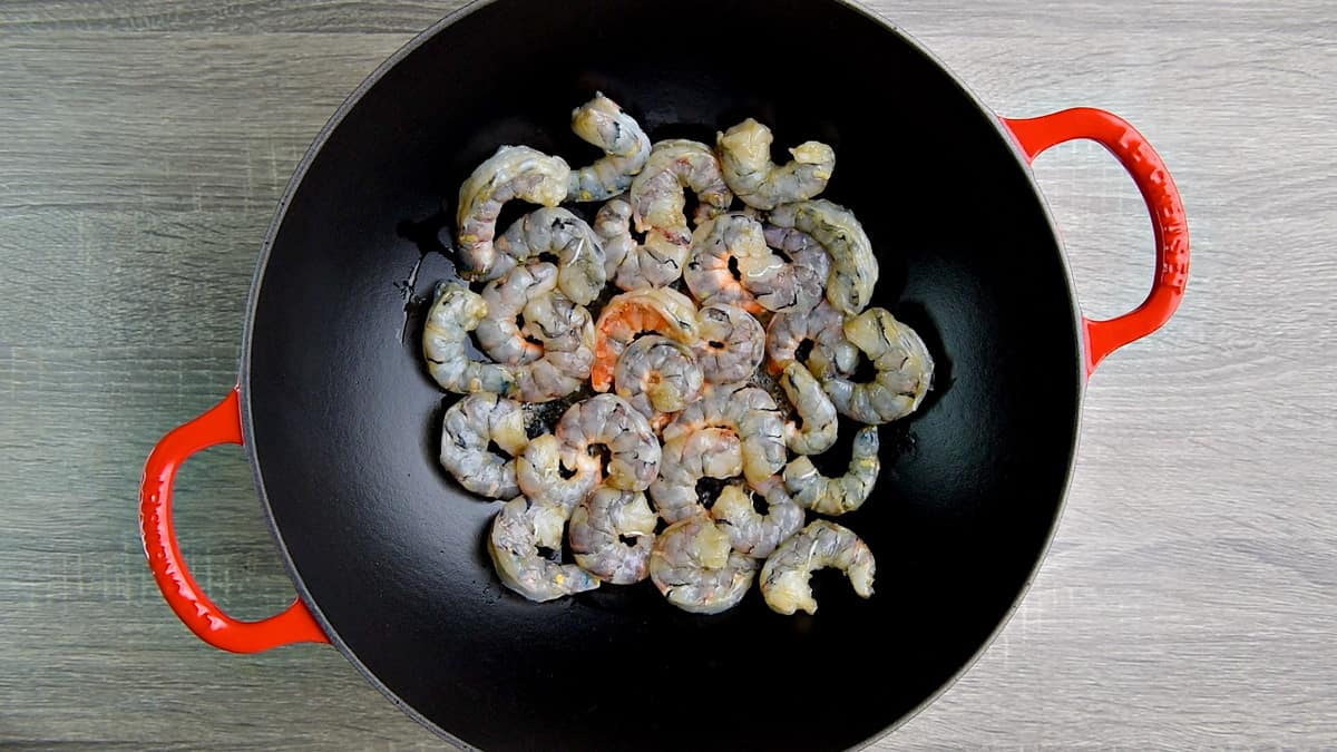 Raw shrimp in a wok.