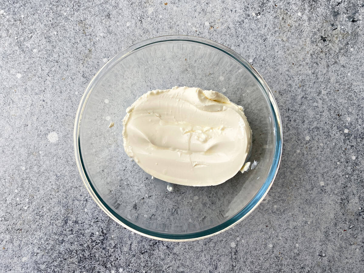 Glass bowl with cream cheese.