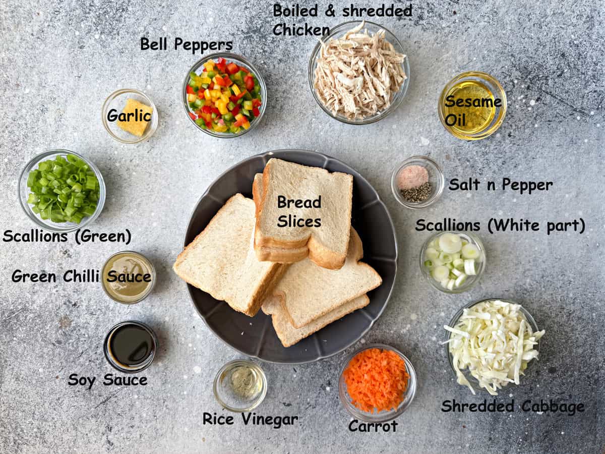 sesame oil, salt and pepper, scallions, bread slices, shredded cabbage, carrot, rice vinegar, soy sauce, green chili sauce, garlic bell peppers, boiled and shredded chicken