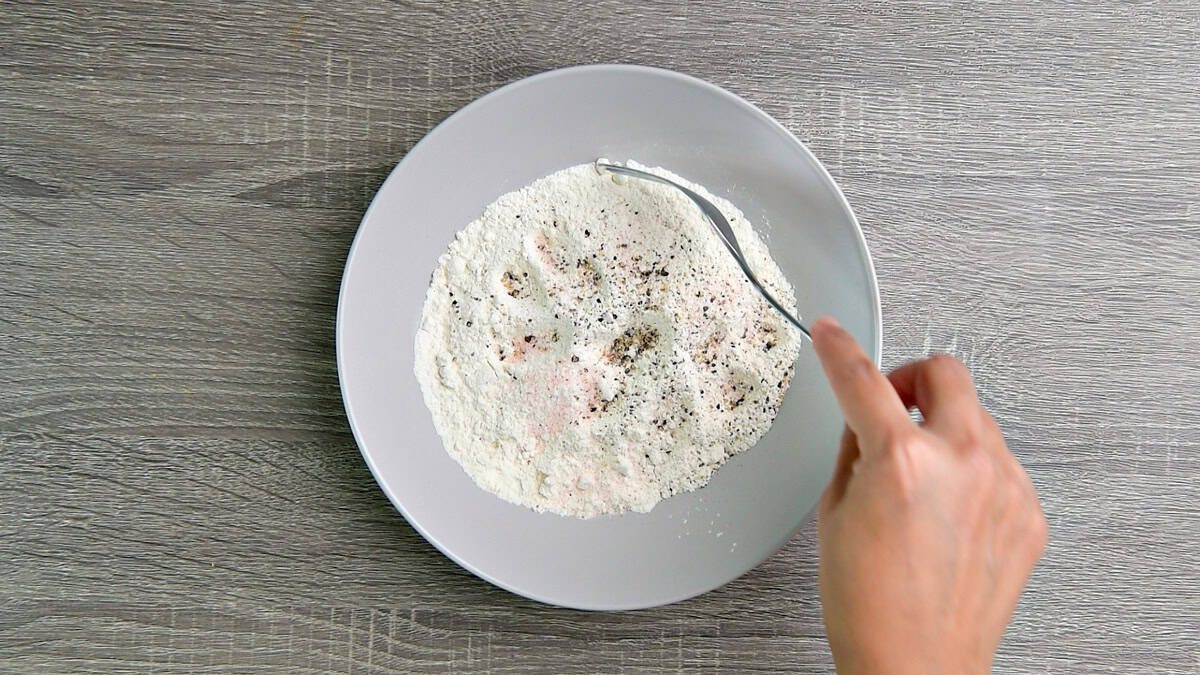 A bowl of seasoned flour.