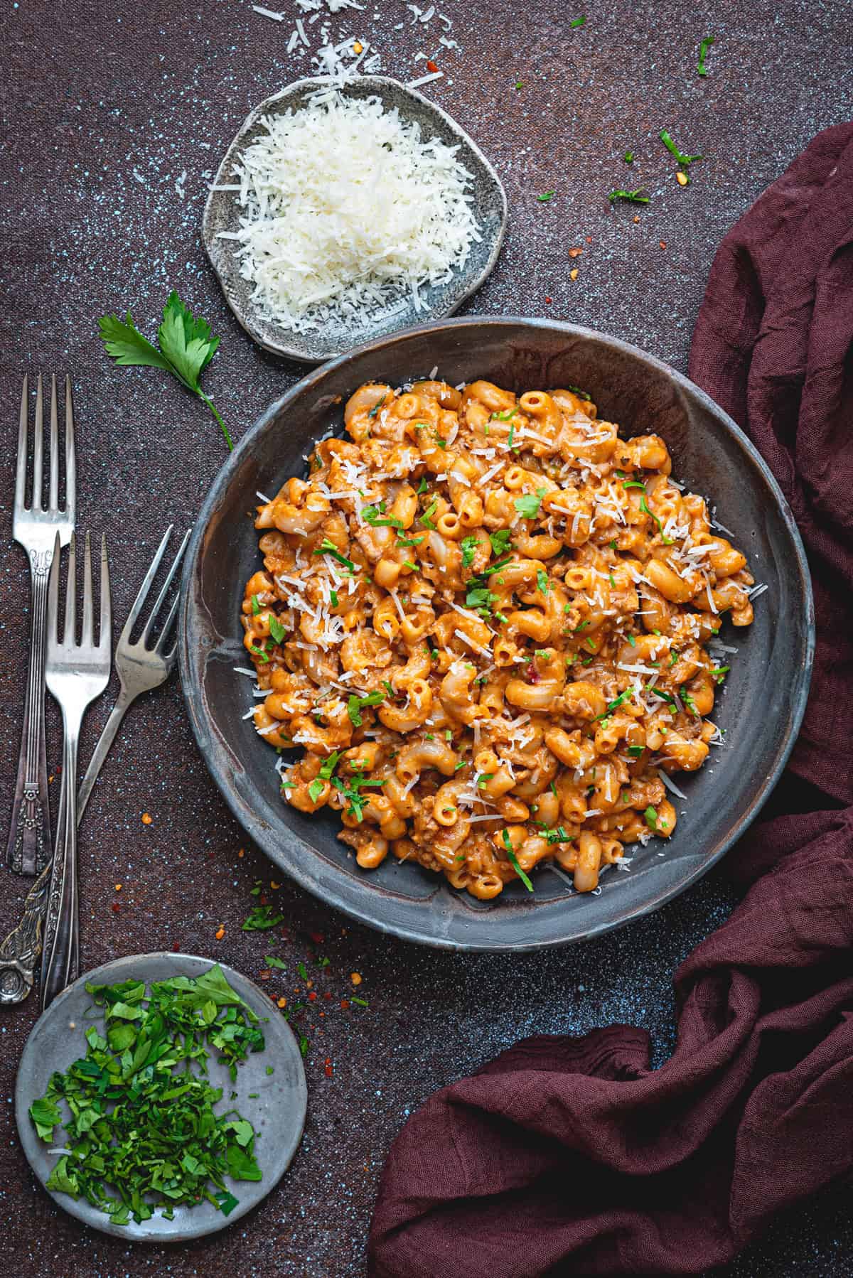 Top down view of a gray bowlful of creamy ground beef pasta.