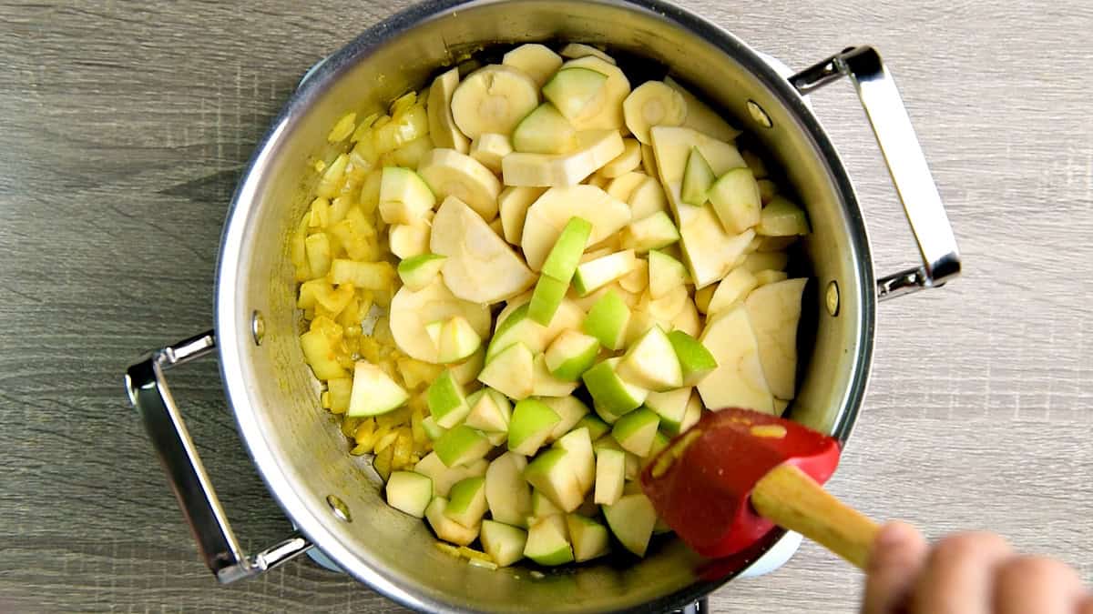 Sliced parsnips and diced apples added to the pot.