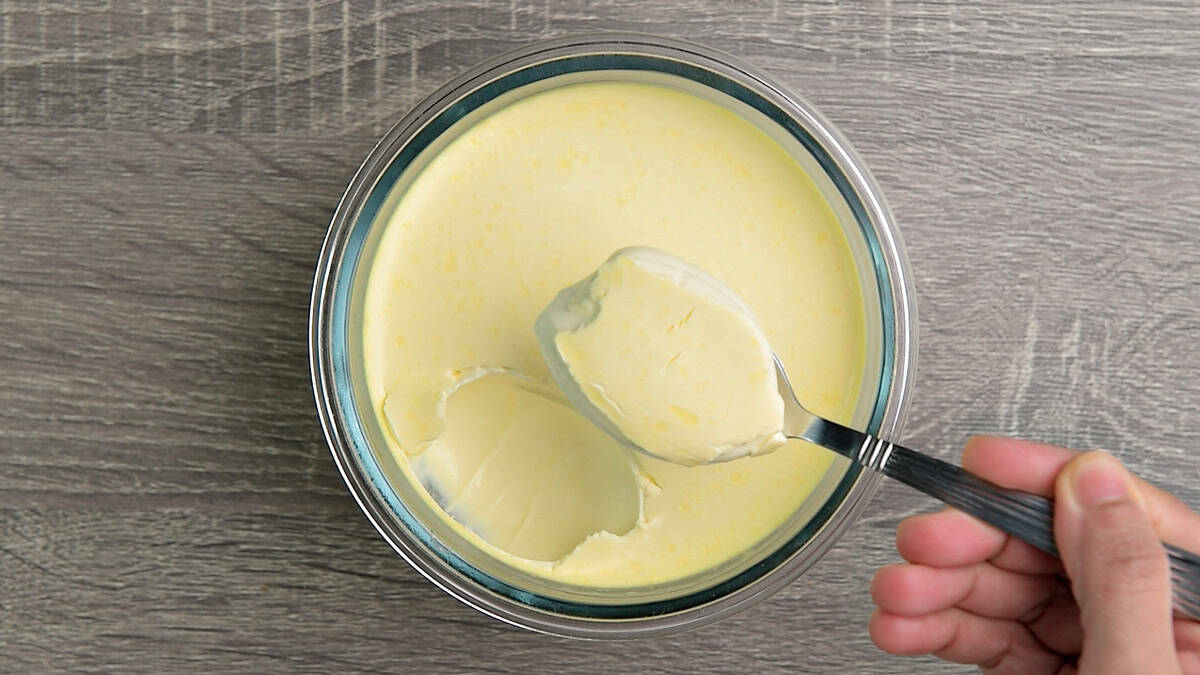 Top-down view of sour cream ready to be served after fermentation and chilling in the fridge.
