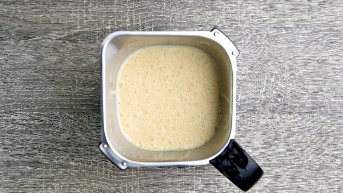 The frothy creamy custard base in the blender jar.