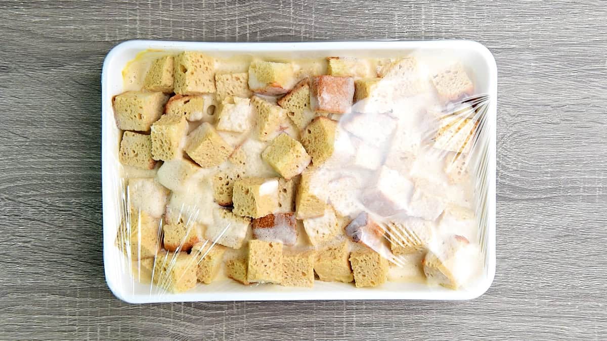 The cubes in a dish covered with plastic wrap to set in the fridge overnight.