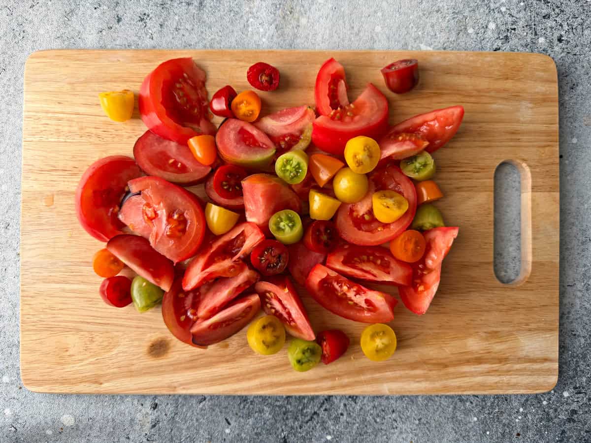 Tomatoes, both large and cherry sliced and halved for salad.