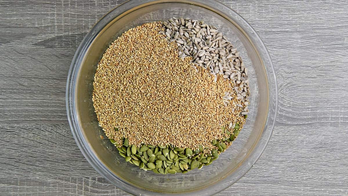 Additional seeds like pumpkin, sunflower, and sesame seeds added to the gelatinous flaxseed meal and spice mixture.